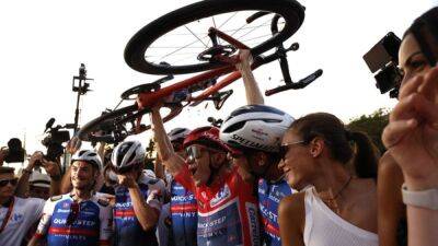 Evenepoel wins Vuelta a Espana for first Grand Tour title