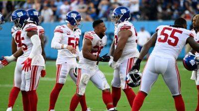 Daboll's Giants rally from 13 down to beat Titans