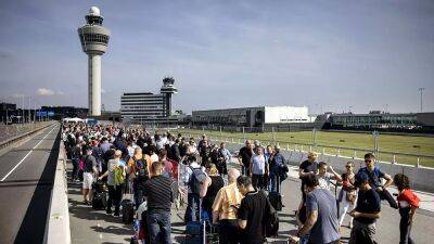 Schiphol queues: Airport slammed for flight cancellations and four hour delays as lines build again