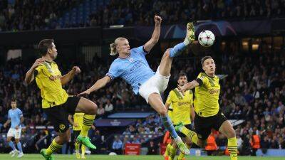 Erling Haaland and John Stones score stunners as Manchester City come from behind to beat Borussia Dortmund