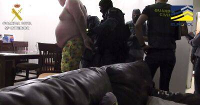 Dramatic moment former Rochdale doorman and alleged Kinahan cartel 'enforcer' is arrested in his shorts in Spain - manchestereveningnews.co.uk - Manchester - Spain