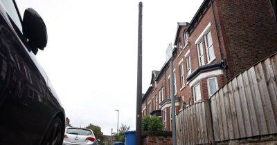 Mystery telegraph poles spring up outside homes in Greater Manchester town with note attached