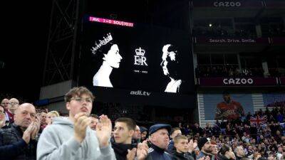 Football pays tribute to Queen Elizabeth as Premier League resumes - in pictures