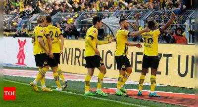 Youssoufa Moukoko goal sends Dortmund top, Marco Reus injured