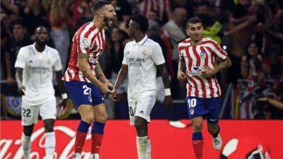 Real Madrid triumph at rivals Atletico in spiky derby