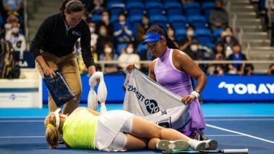 Naomi Osaka ends her four-match losing streak after Daria Saville retires due to nasty knee injury in Tokyo