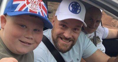 Schoolboy tags along with Tyson Fury for his morning jog - after travelling 50 miles and camping out all night