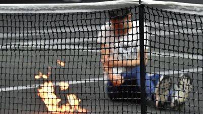 Protester sets his arm on fire at Laver Cup - rte.ie - Britain - London