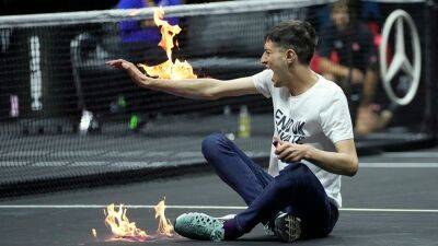 Roger Federer - Laver Cup 2022: Climate change protester storms the court, lights arm on fire - foxnews.com - Britain - Argentina - London - Greece