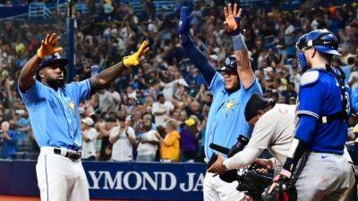 Arozarena drives in 6 runs as Rays defeat Blue Jays, tie for AL wild-card lead