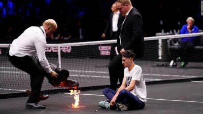 Roger Federer - Protester sets arm on fire during Laver Cup tennis match ahead of Federer's farewell - edition.cnn.com - Britain - London