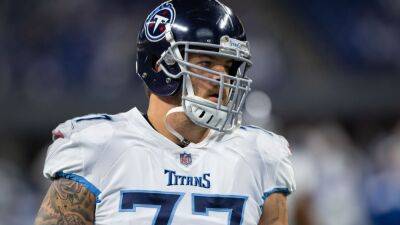 Tennessee Titans LT Taylor Lewan out for season with knee injury, source confirms