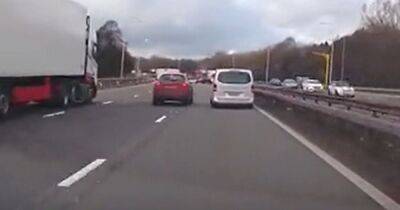 Shocking moment M6 driver swerves to take beer from stag do bus at 70mph