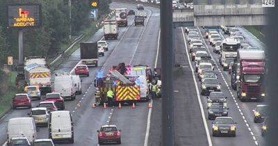Long queues on M4 after car overturns - live updates