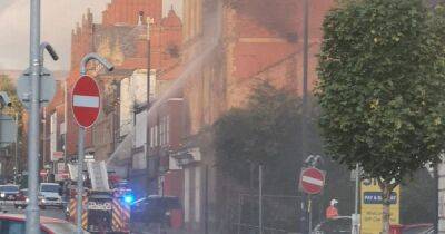 Dramatic scenes as crews block road to tackle huge fire at derelict nightclub