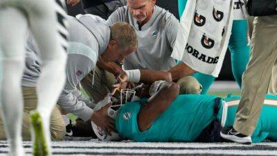 Dolphins QB Tagovailoa stretchered off field with head, neck injuries
