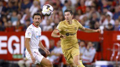 Lewandowski on target again as Barcelona sink Sevilla 3-0