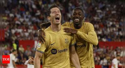 Robert Lewandowski leads Barcelona to win at Sevilla as Real Madrid stay perfect, Atletico Madrid held