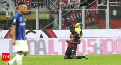 Romelu Lukaku - Stefano Pioli - Rafael Leao - Olivier Giroud - Hakan Calhanoglu - Mike Maignan - Khvicha Kvaratskhelia - Rafael Leao claims derby honours for AC Milan in Serie A, Napoli retake top spot - timesofindia.indiatimes.com - France - Portugal - Italy - Usa