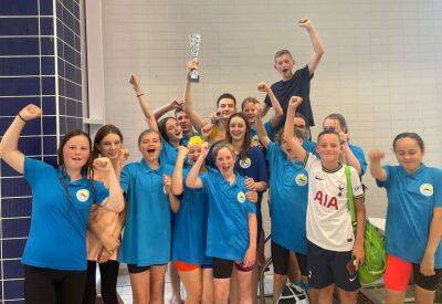 Sheerness Swimming Club and Lifeguard Corps celebrate after winning the Octopus League for the first time in their history