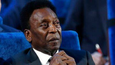 Fans gather at Brazilian stadium to mourn soccer great Pelé before Tuesday funeral