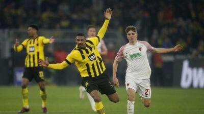 Dortmund earn rollercoaster 4-3 win over Augsburg on Haller return