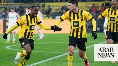 Dortmund beat Augsburg on Haller’s return from cancer