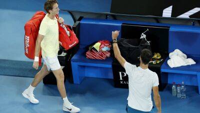 Sebastian Korda retires hurt to send Karen Khachanov to last four at the Australian Open