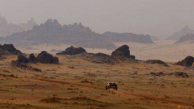 Rallying-Qatar's Al-Attiyah takes Dakar lead as Sainz hits trouble