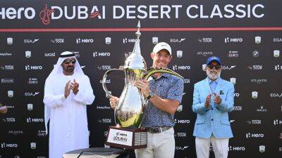 McIlroy holds off Reed to win Dubai Desert Classic in thrilling fashion