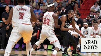 Nets win against Heat but lose Durant to injury; 76ers cruise past Pistons