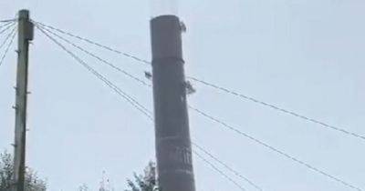 'Going...going...gone': The moment chimney at historic former mill was blown up and brought down