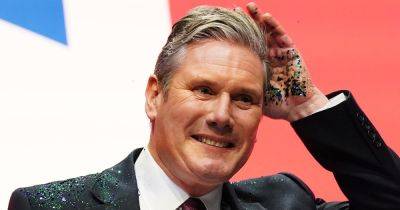 Man arrested after Keir Starmer is covered in glitter on stage as group claims responsibility for protest