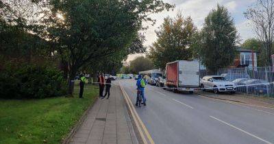 BREAKING: Road taped off after 'unexplained death' following vehicle fire in Altrincham - live updates