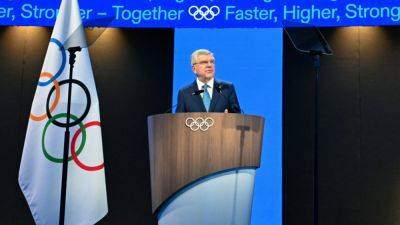 IOC president Bach coy as members call for rule change to extend his term