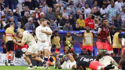 England hold nerve to edge out gallant Fiji