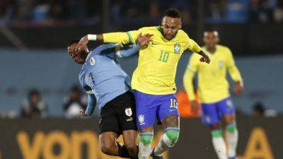 Brazil's Neymar suffers knee injury in Uruguay match