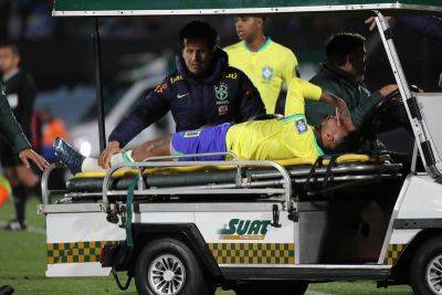 Neymar leaves pitch in tears after knee injury in Brazil defeat to Uruguay