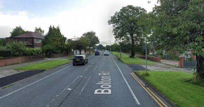 Police close main road after crash between car and motorbike