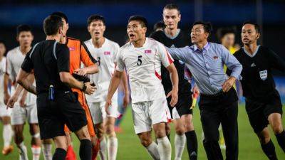 North Korean footballers clash with referee after losing Asian Games quarter-final tie to Japan