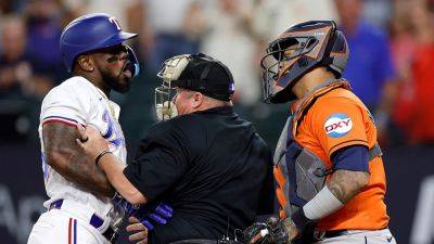 Rangers' Adolis Garcia hit by pitch and benches clear, sparking ejections; Jose Altuve hits go-ahead homer