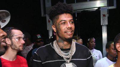 Rapper Blueface turns private suite at Rams game into personal strip club, then proposes to girlfriend