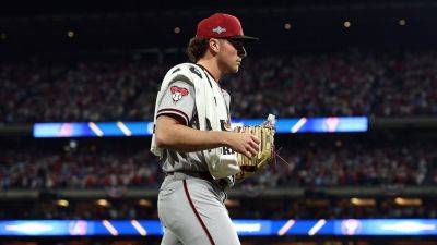 Diamondbacks' Brandon Pfaadt appears to read Bible before taking mound in Game 7 of NLCS