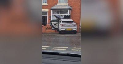 Dramatic CCTV footage shows moment Jaguar smashes into front of house as neighbours evacuated