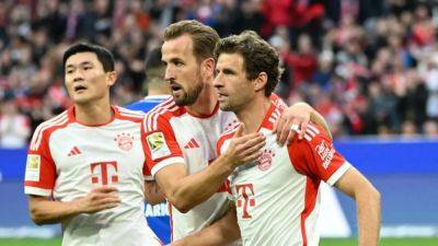 Bayern crush Darmstadt 8-0 with Kane hat-trick amid sea of red