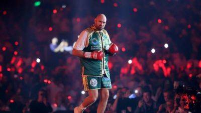 Oleksandr Usyk - Tyson Fury - Francis Ngannou - Fury knocked down but beats Ngannou on a split decision - channelnewsasia.com - France - Ukraine - Cameroon - Saudi Arabia