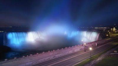 Niagara Falls lights up in blue and white to cheer on the Toronto Blue Jays