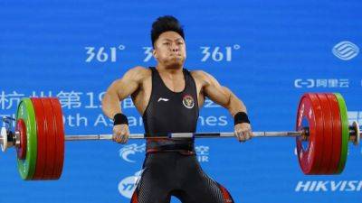 Games-Indonesian strongman sets weightlifting world record in Hangzhou