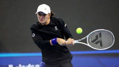 Swiatek overcomes early deficit to beat Vondrousova at WTA Finals