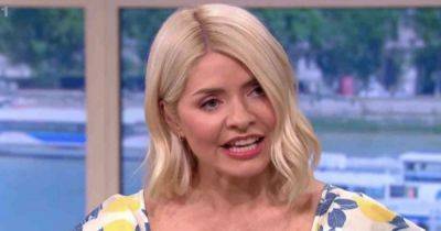 Holly Willoughby 'under police watch' amid 'kidnap plot' arrest as she's pulled out of This Morning